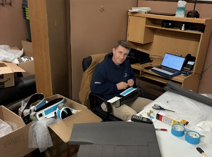 Prepping for Moose Captures: A Behind the Scenes Look 1 Chest Deep: Taylor Velander, a PhD candidate from the University of Minnesota – Duluth, in the process of getting collars field ready.